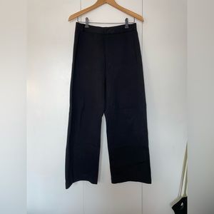 Uniqlo U black curved leg pants.